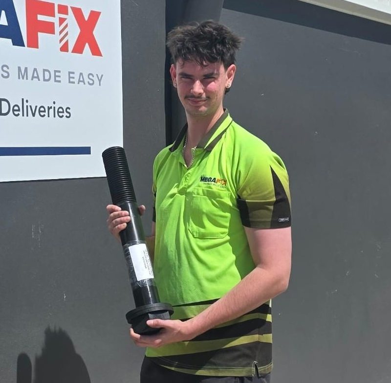 MEGAFIX team member with a custom manufactured bolt